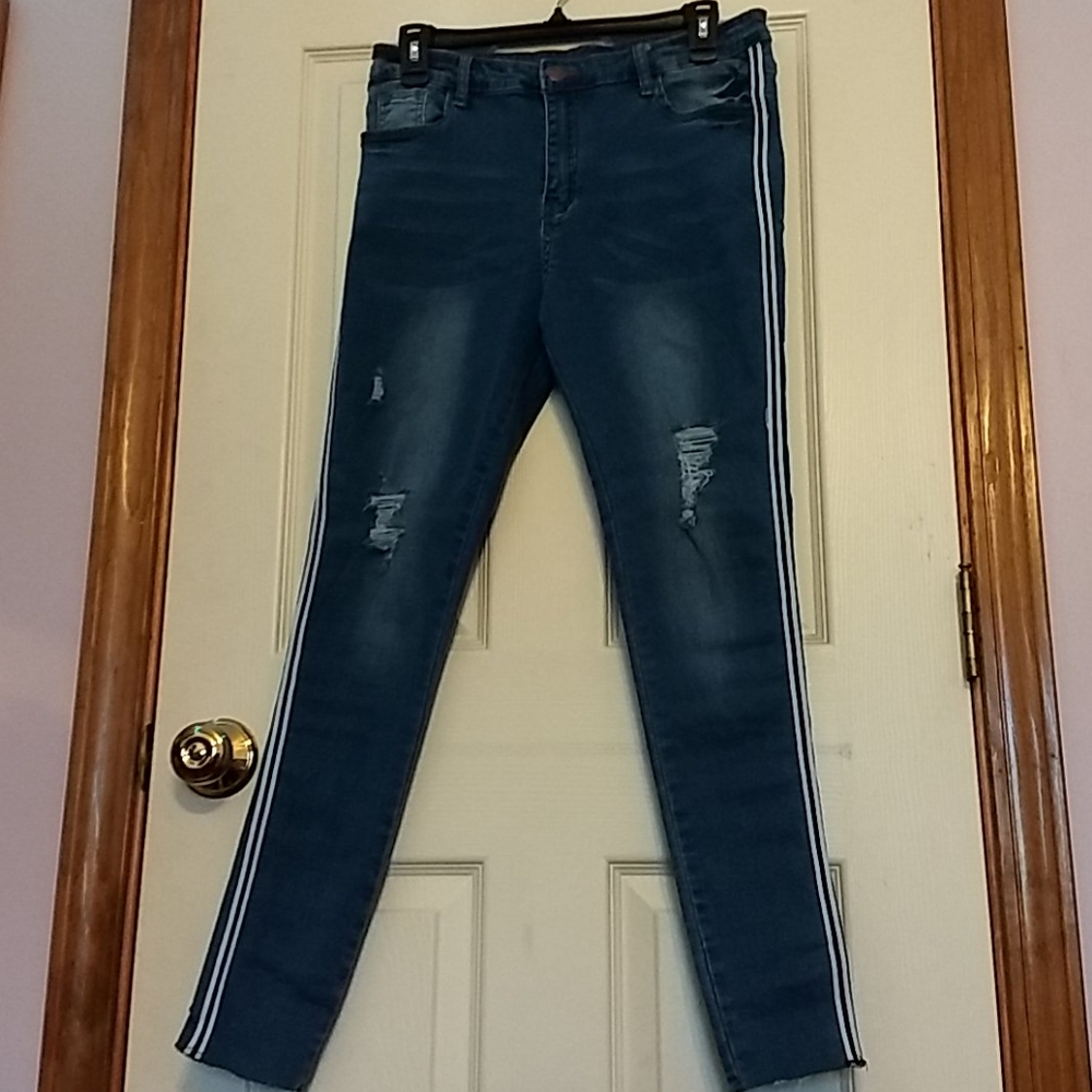 Jeans with rips and stripes